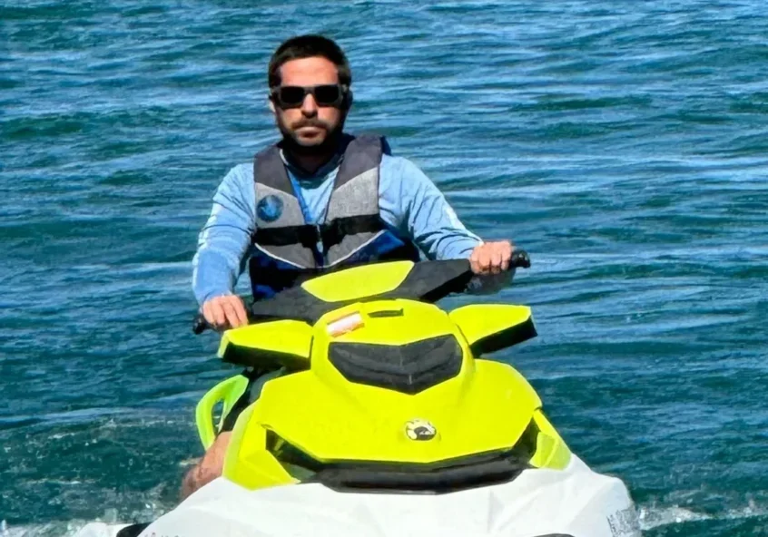 Man riding a jet ski on water.
