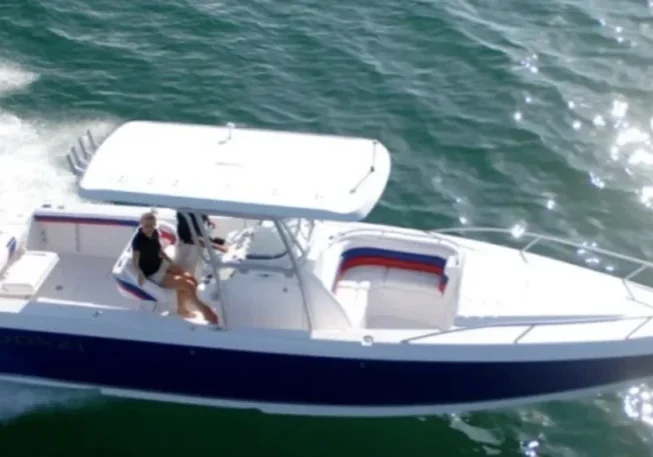 Speedboat cruising on clear ocean water.